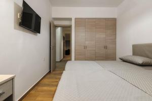 Postel nebo postele na pokoji v ubytování Oresteia Downtown Apartment