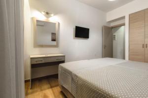 Postel nebo postele na pokoji v ubytování Oresteia Downtown Apartment