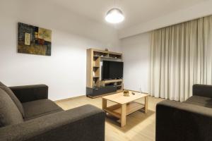 Posezení v ubytování Oresteia Downtown Apartment