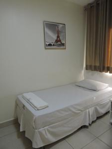 Een bed of bedden in een kamer bij Hotel Rio Branco