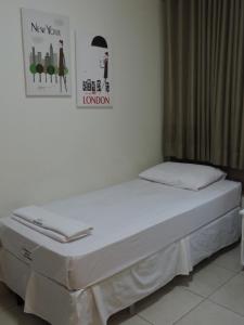 Cama ou camas em um quarto em Hotel Rio Branco