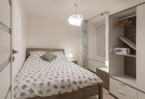 Posteľ alebo postele v izbe v ubytovaní Apartamenty W Starym Ogrodzie