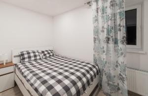 Posteľ alebo postele v izbe v ubytovaní Apartamenty W Starym Ogrodzie