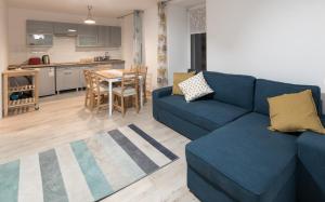 Kuchyňa alebo kuchynka v ubytovaní Apartamenty W Starym Ogrodzie
