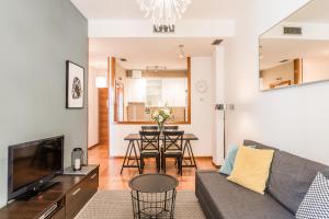 a living room with a couch and a table at Waou Gran Via I - Alquiler Corta Duración in Madrid