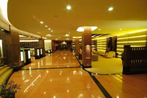 a lobby of a building with a lobby at Furama Chiang Mai in Chiang Mai