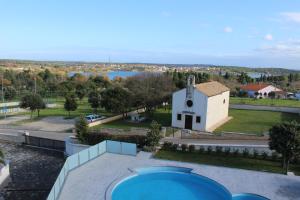 arial view of a church and a view of the water at Apartmani Uwe in Banjole