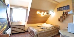 A bed or beds in a room at Elite Apartment Konaci