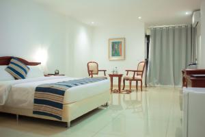 Ein Bett oder Betten in einem Zimmer der Unterkunft Hôtel Millennium Kamissa