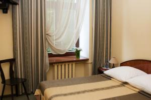 Postel nebo postele na pokoji v ubytování Wien Hotel + 37 fotografií
