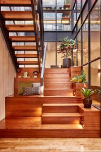 a staircase with wooden steps in a building at The Publishing House Bed and Breakfast in Chicago