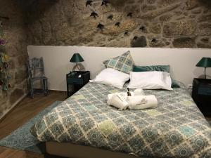 Uma cama ou camas num quarto em O Cantinho da Ana