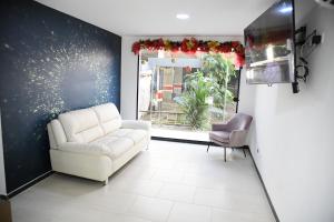 TV a/nebo společenská místnost v ubytování Hotel Milla de Oro Uraba + 26 fotografií