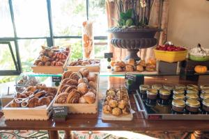a display of different types of pastries on a table at Four Seasons Resort The Biltmore Santa Barbara in Santa Barbara
