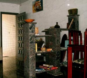 a room with two stone shelves in a room at Itaguá Guest House in Ubatuba