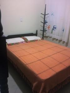A bed or beds in a room at Seo Chico Sobradinho
