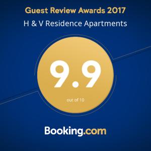 a yellow circle with the text quest review awards h v residence apartments at H & V Residence - Split Level Apartment in Arad