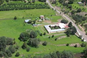 an aerial view of a farm with animals in a field at Hotel Paraiso del Oso in Cerocahui