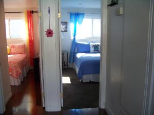 Posteľ alebo postele v izbe v ubytovaní Beach House