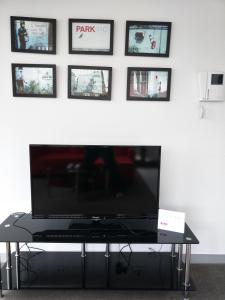 A television and/or entertainment center at Homely Getaways @ Queen Vic Market