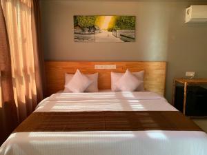 Llit o llits en una habitació de Old Town Inn Maldives