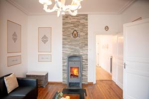 Posezení v ubytování Zythogite Appartement 8 personnes avec jardin, bbq