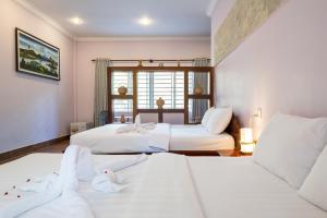 Cama o camas de una habitación en Kep Bungalows