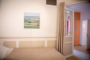 Postel nebo postele na pokoji v ubytování Zythogite Appartement 8 personnes avec jardin, bbq