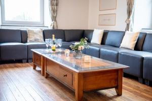 Posezení v ubytování Zythogite Appartement 8 personnes avec jardin, bbq