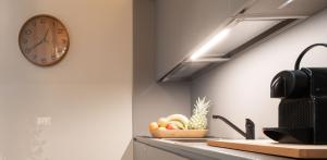 A kitchen or kitchenette at OFFICINE CAVOUR Piazza Cavour