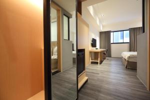 Postel nebo postele na pokoji v ubytování Hai Sheng Wei B&B