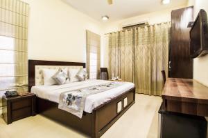 מיטה או מיטות בחדר ב-Kelvish Hotel-Delhi Airport
