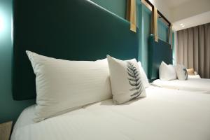 Postel nebo postele na pokoji v ubytování Hai Sheng Wei B&B