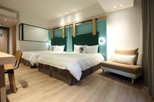 Postel nebo postele na pokoji v ubytování Hai Sheng Wei B&B