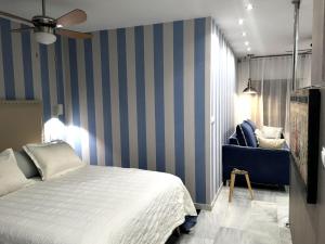 A bed or beds in a room at Malaka