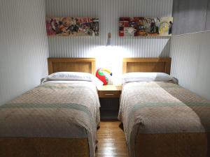 A bed or beds in a room at Malaka