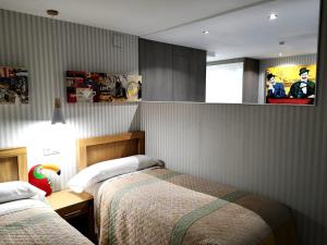 A bed or beds in a room at Malaka