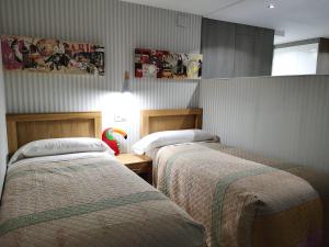 A bed or beds in a room at Malaka