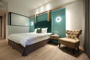 Postel nebo postele na pokoji v ubytování Hai Sheng Wei B&B