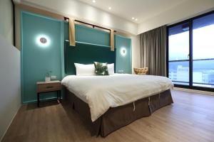 Postel nebo postele na pokoji v ubytování Hai Sheng Wei B&B