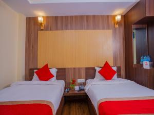 Postel nebo postele na pokoji v ubytování Hotel Deepshree