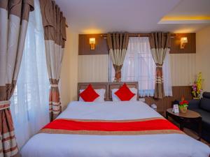 Postel nebo postele na pokoji v ubytování Hotel Deepshree