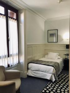 Cama ou camas em um quarto em Hotel Olajauregi