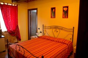 Postel nebo postele na pokoji v ubytování Agriturismo Monbertola