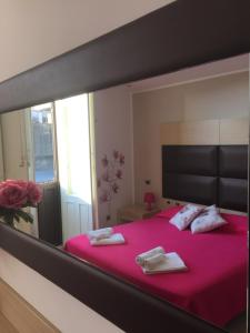 A bed or beds in a room at Loft Marconi Siracusa