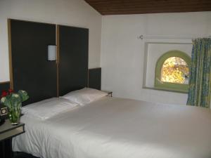 Letto o letti in una camera di Hôtel La Chartreuse