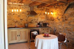 A kitchen or kitchenette at Les Chalets de Ludran