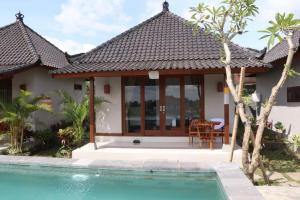 Bazén v ubytování Paraiso Cottage Ubud nebo v jeho okolí