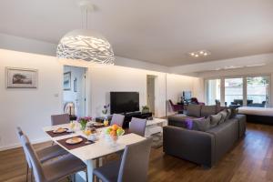 a living room with a table and a couch at Apartments Nav in Dubrovnik