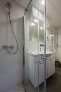 a bathroom with a shower and a sink at Hotel Sveti Kriz in Trogir